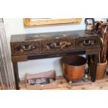 Oriental black lacquered and landscape decorated three drawer console table on stand,