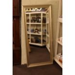Silvered framed rectangular wall mirror, 166cm by 76cm overall.