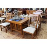 Oak Arts & Crafts style eight piece dining suite comprising two door sideboard,