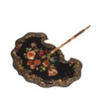 Victorian papier-mache face screen with floral and gilt decoration, 29cm across.