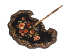 Victorian papier-mache face screen with floral and gilt decoration, 29cm across.