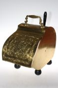 Brass coal scuttle with handle, 42cm high.