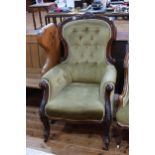 Victorian mahogany framed armchair in buttoned fabric.