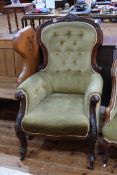 Victorian mahogany framed armchair in buttoned fabric.