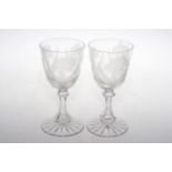 Pair of large wine goblets, the bowls etched with flowers and on hexagonal stems, 19cm.