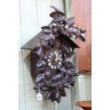 Black Forest carved cuckoo clock and weights.