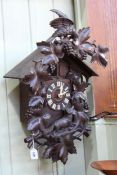 Black Forest carved cuckoo clock and weights.