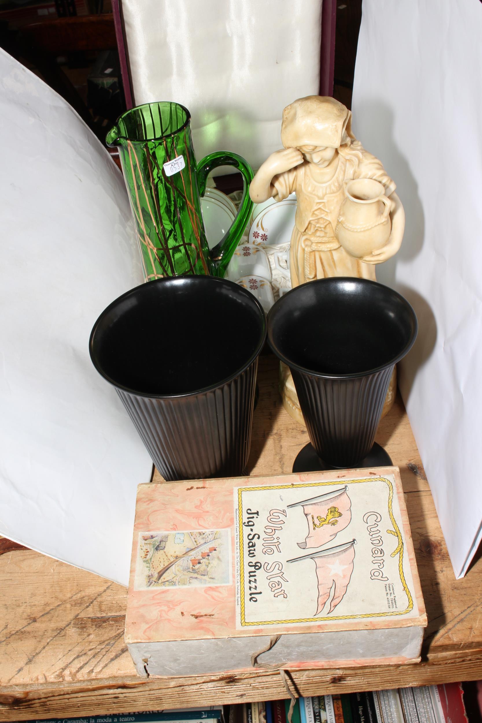 Boxed set of six coffee cans and five saucers, two Wedgwood vases, figure and green glass jug,