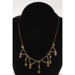 Peridot, seed pearl and pink stone elegant necklace in 9 carat gold.