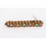 15 carat gold, turquoise and seed pearl twist form brooch, 4.25cm across.