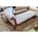 Edwardian oak framed chaise longue on turned legs.