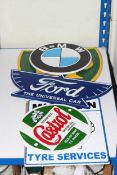 Five cast metal advertising signs 'Castrol', 'Michelin', 'BP', 'Ford' and 'BMW'.