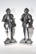 Pair of white metal standing knights, 43cm high.