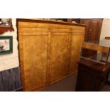 19th Century satin birch three door wardrobe, 177cm by 250cm by 58cm.