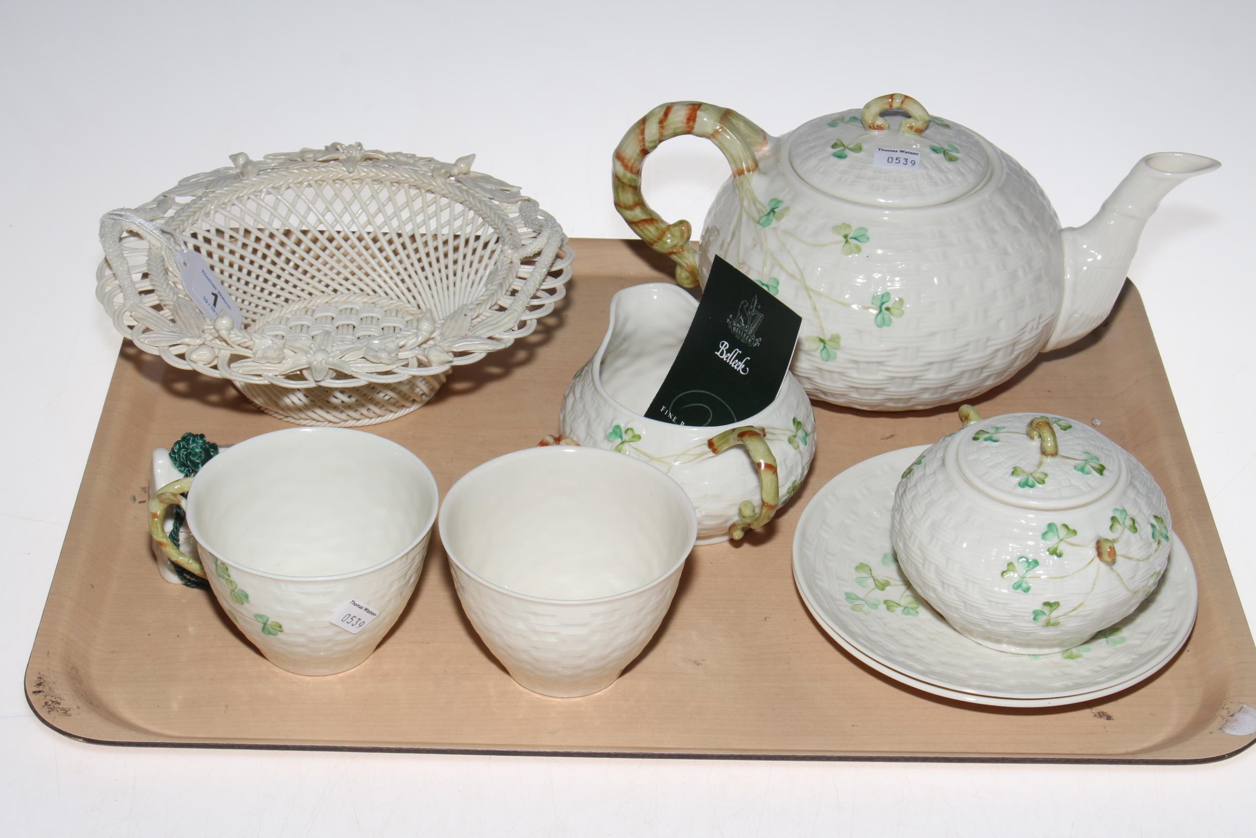 Belleek seven piece tea for two, basket work bowl and small bell.