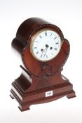 Mahogany balloon shaped mantel clock, 34cm high.