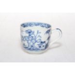 19th Century Oriental pottery blue and white cup decorated with trees and flowers.