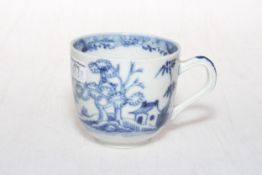 19th Century Oriental pottery blue and white cup decorated with trees and flowers.