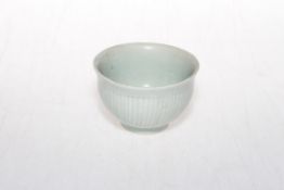 Chinese Sony Dynasty Qingbai tea bowl with vertical line decoration, collectors reference to base,