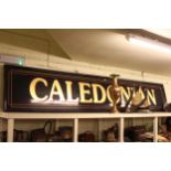 Rectangular wall mounted 'Caledonian' pub sign, 350cm long by 65cm high.