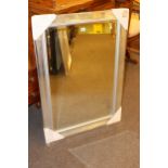 Box corner bevelled wall mirror, 105cm by 75cm.