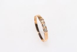 Gold three stone diamond ring, size O.