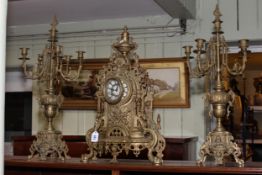 Large ornate gilt metal three piece clock garniture.