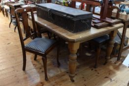 Late 19th/early 20th Century oak extending dining table, leaf and winder,