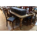 Late 19th/early 20th Century oak extending dining table, leaf and winder,