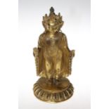Tibetan gilt bronze Bodhisattva, standing with arms and palms forward, 33cm.