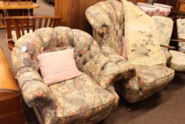 Pair Lincoln House ladies and gents chairs and footstool in foliate pattern fabric,