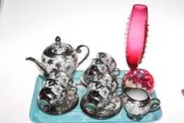 Fourteen pieces of china and silvered overlay style teaware and two ruby glass vases.