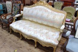Antique giltwood arched back settee with serpentine front seat, 120cm by 176cm.