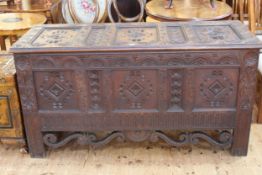 Good carved oak triple panel front kist dated 1867 to interior of lid, 81cm by 155cm by 60cm.