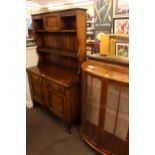1920's/30's oak shelf back dresser and walnut bow front two door china cabinet.