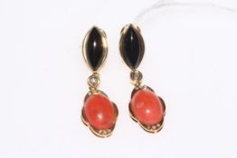 Coral and onyx pendant earrings set in 18 carat gold.