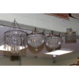Collection of four lustre drop light fittings including a pair of circular fittings.