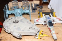 Collection of Star Wars toys including Millennium Falcon.