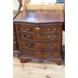 Mahogany serpentine front chest having brush slide above four long drawers on bracket feet,