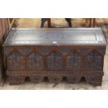 Carved arched panel front box/trunk, 46cm by 95cm by 41cm.