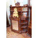 Victorian figured walnut side cabinet having shelf back with twist supports above a shaped front