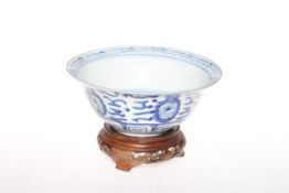 Chinese blue and white bowl with carved wood stand, 16.5cm diameter.