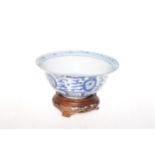 Chinese blue and white bowl with carved wood stand, 16.5cm diameter.