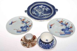 Collection of Chinese ceramics including plate warmer, two plates, tea bowl, and cup and saucer.