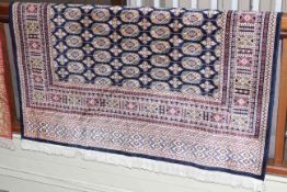 Bokhara carpet with a blue ground 2.30 by 1.60.