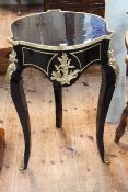 Black lacquered and gilt mounted circular shaped top lamp table, 77cm.