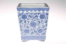 Chinese blue and white square planter of tapering form decorated with floral design, 25cm high.