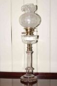 Duplex glass column oil lamp with brass fitting, clear glass reservoir and etched shade.