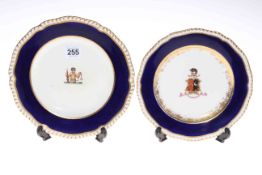 Two early 19th Century probably Worcester armorial plates, largest 22cm diameter.