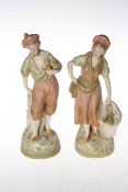 Pair Royal Dux figures of man with pipe and woman with fish basket, pink triangle mark, 22cm.